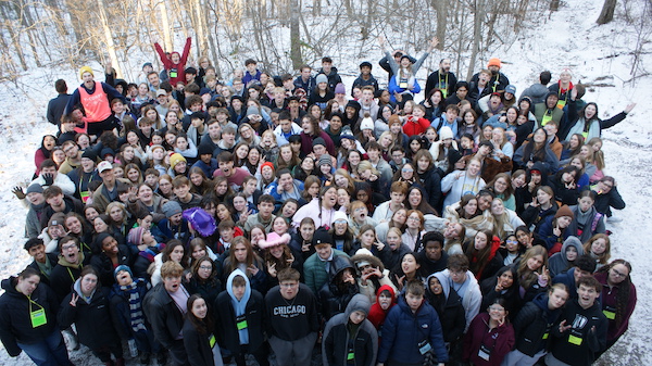 Outdoor photo looking down on a group of over 200 participants